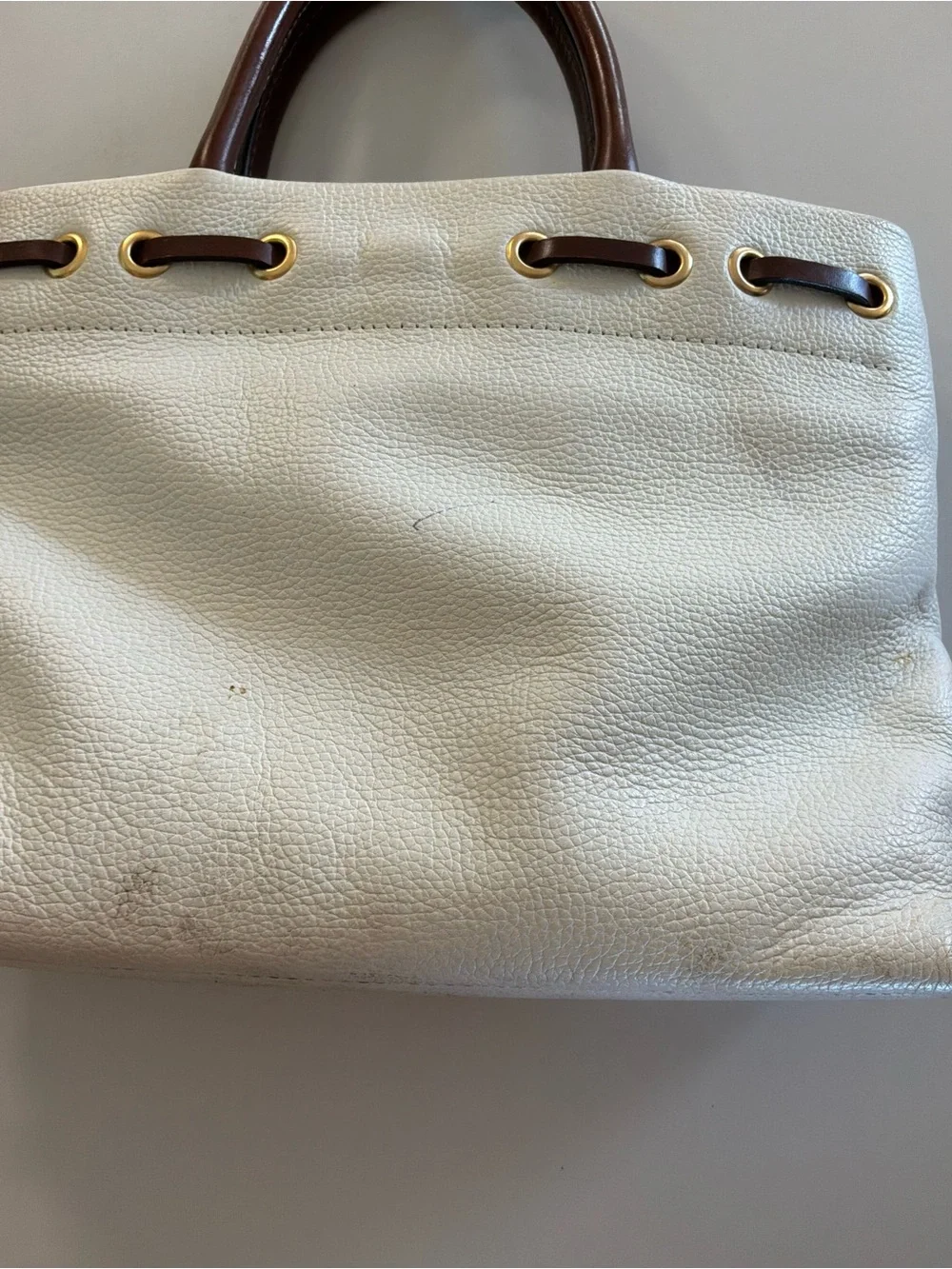 Dooney & Bourke White Pebbled Leather Satchel with Brown Trim and Tassel
